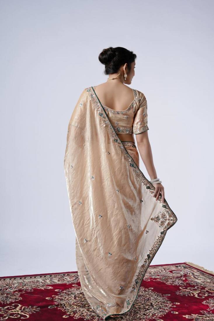 Celebrity inspired cream embroiderd border satin saree with unstitched blouse