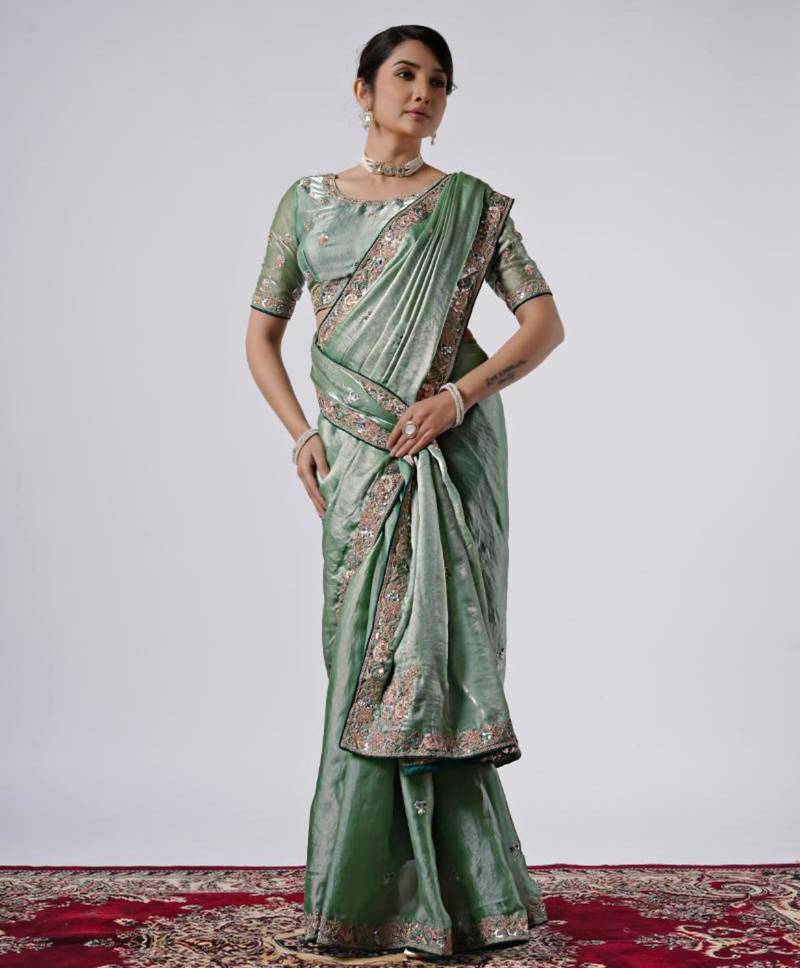 Bollywood green emboriderd border satin saree with unstitched blouse