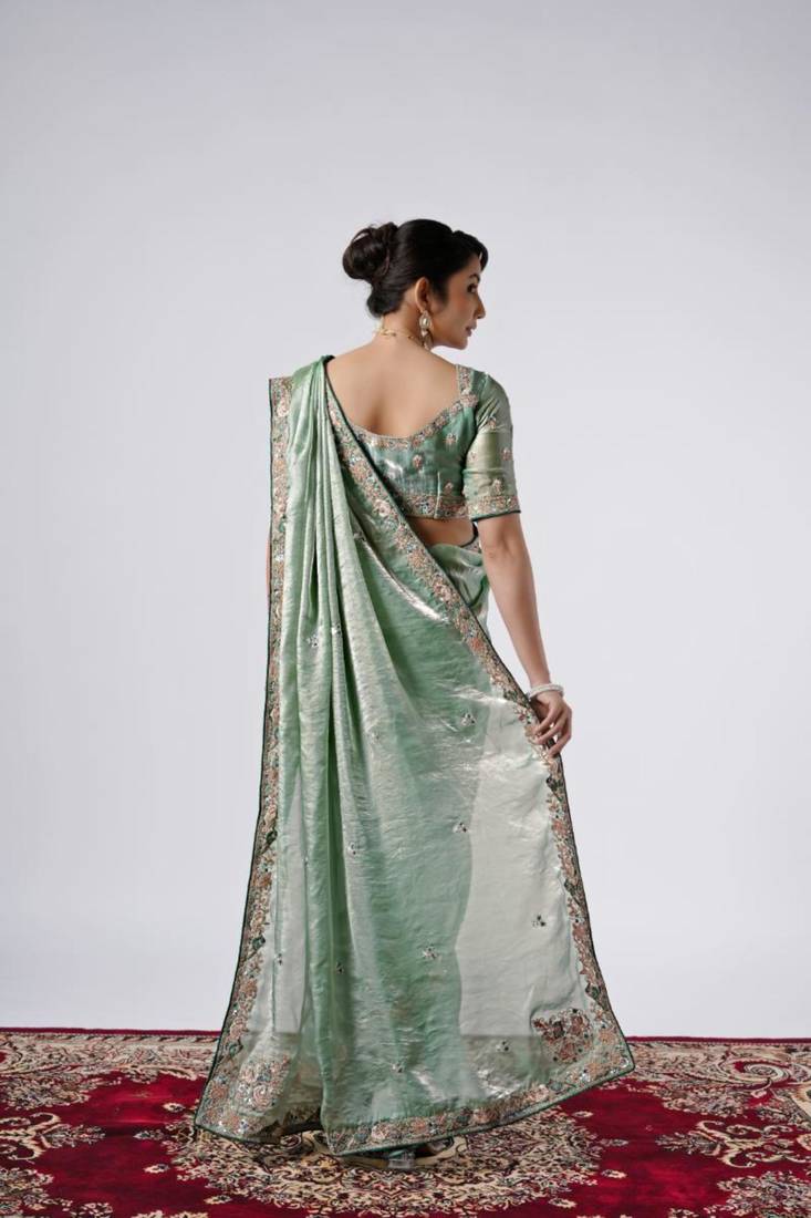 Bollywood green emboriderd border satin saree with unstitched blouse