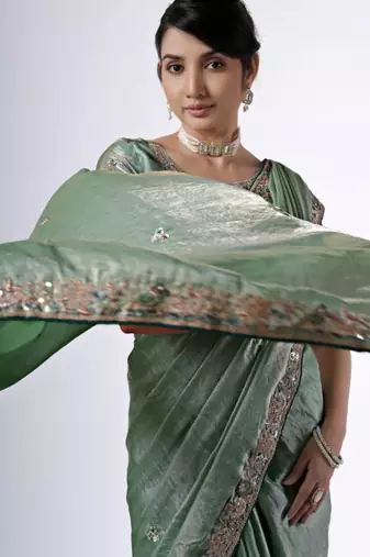 Bollywood green emboriderd border satin saree with unstitched blouse