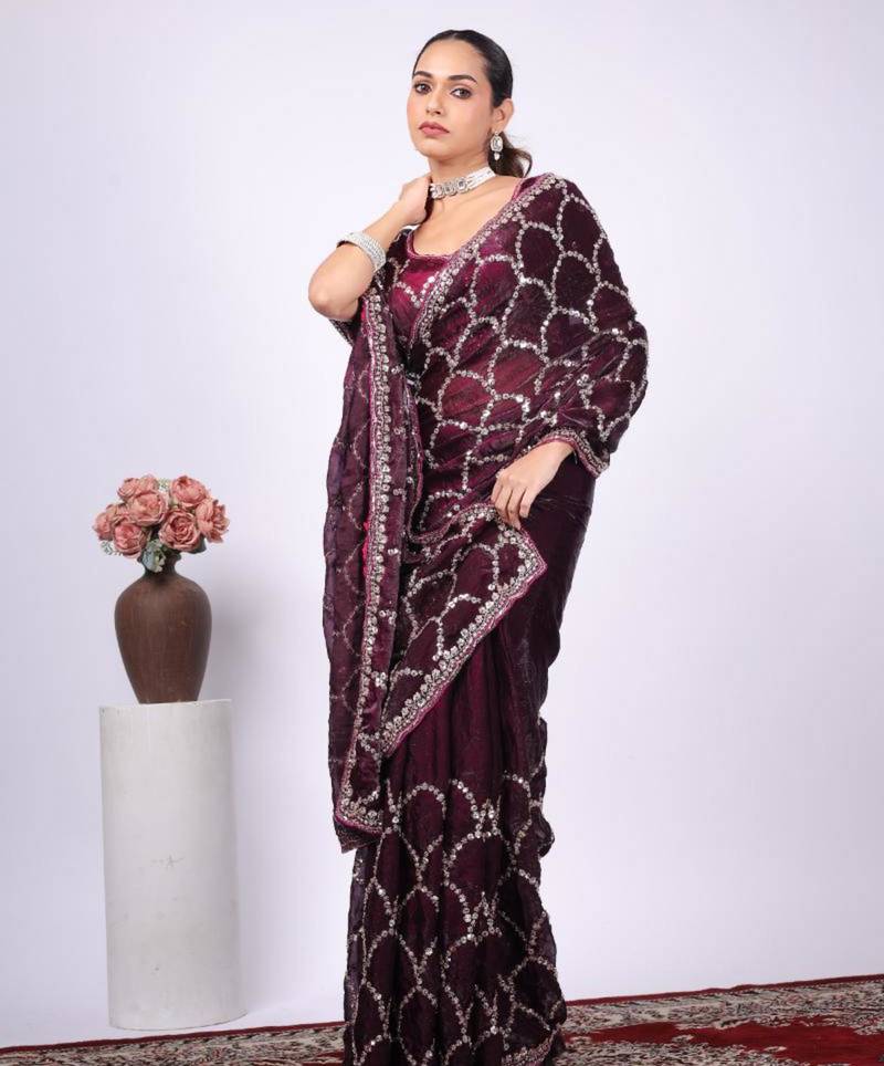 Celebrity type purple embroidered border fandy satin saree with unstitched blouse