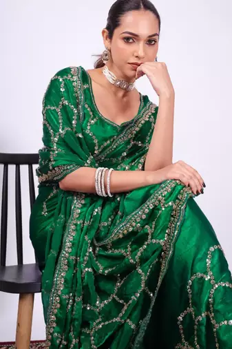 Embellished green embroidered border fandy satin saree with unstitched blouse