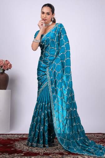 Traditional teal blue embroidered border fandy satin saree with unstitched blouse