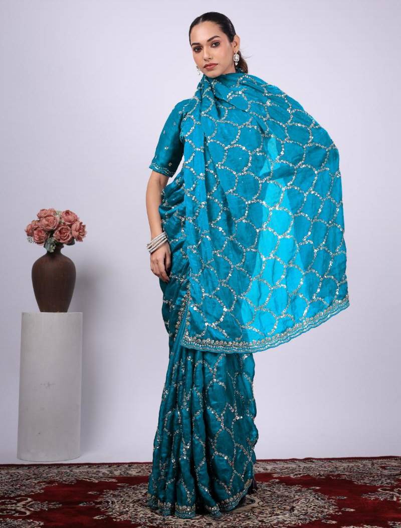 Traditional teal blue embroidered border fandy satin saree with unstitched blouse