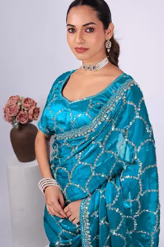 Traditional teal blue embroidered border fandy satin saree with unstitched blouse