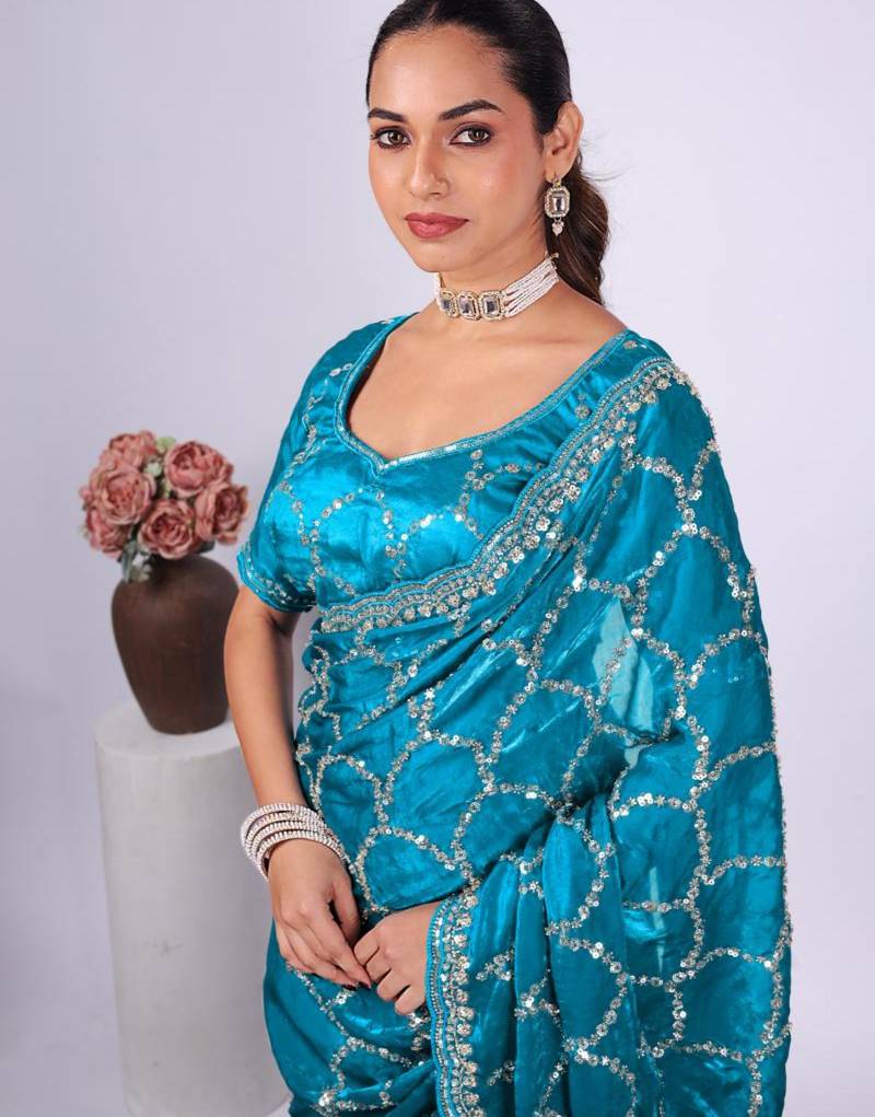 Traditional teal blue embroidered border fandy satin saree with unstitched blouse