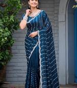 Ethnic midnight blue embellished pattern with border fandy satin saree with unstitched blouse