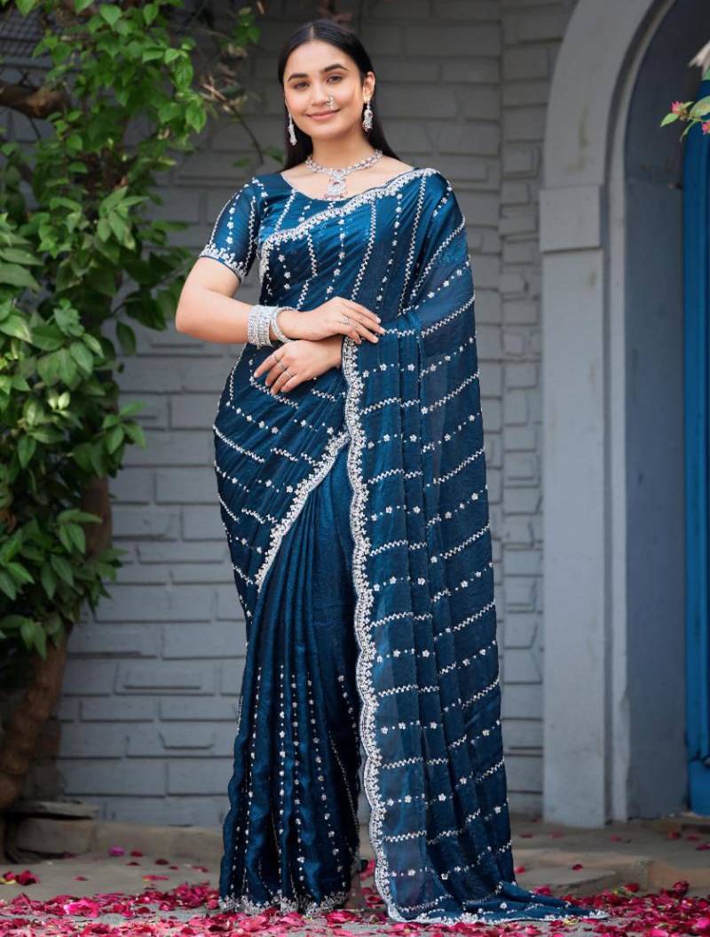 Ethnic midnight blue embellished pattern with border fandy satin saree with unstitched blouse