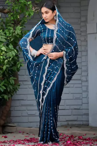 Ethnic midnight blue embellished pattern with border fandy satin saree with unstitched blouse