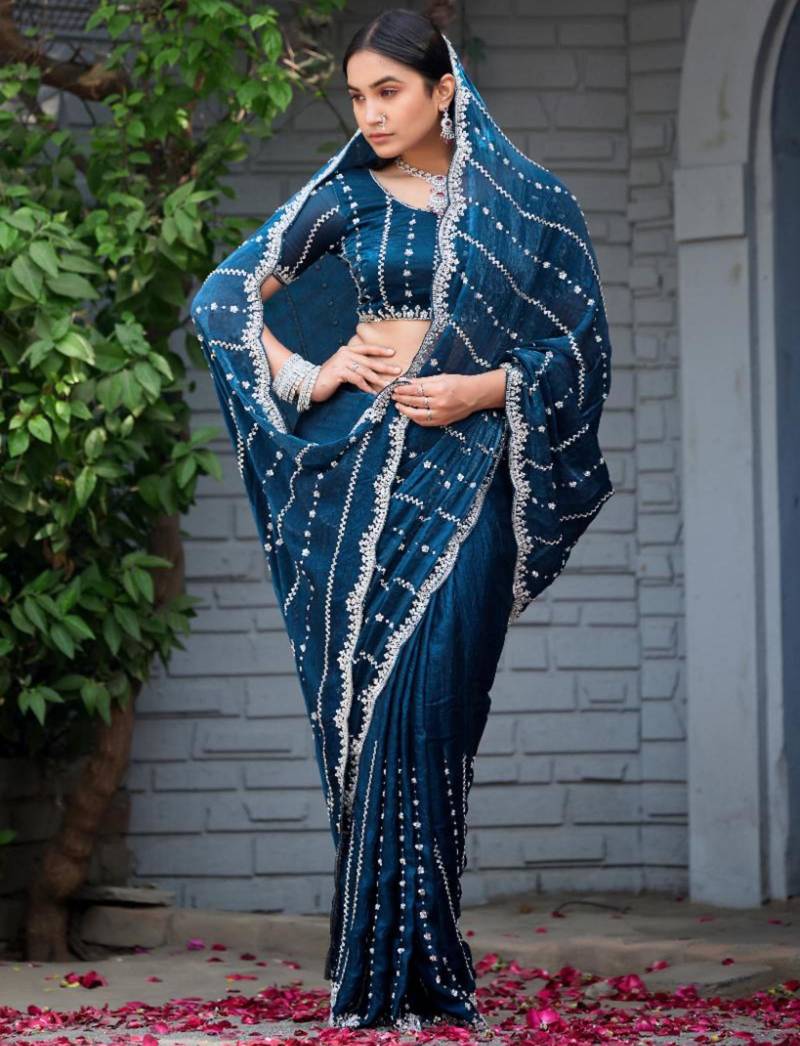 Ethnic midnight blue embellished pattern with border fandy satin saree with unstitched blouse