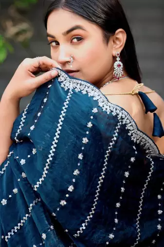 Ethnic midnight blue embellished pattern with border fandy satin saree with unstitched blouse