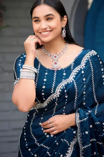 Ethnic midnight blue embellished pattern with border fandy satin saree with unstitched blouse