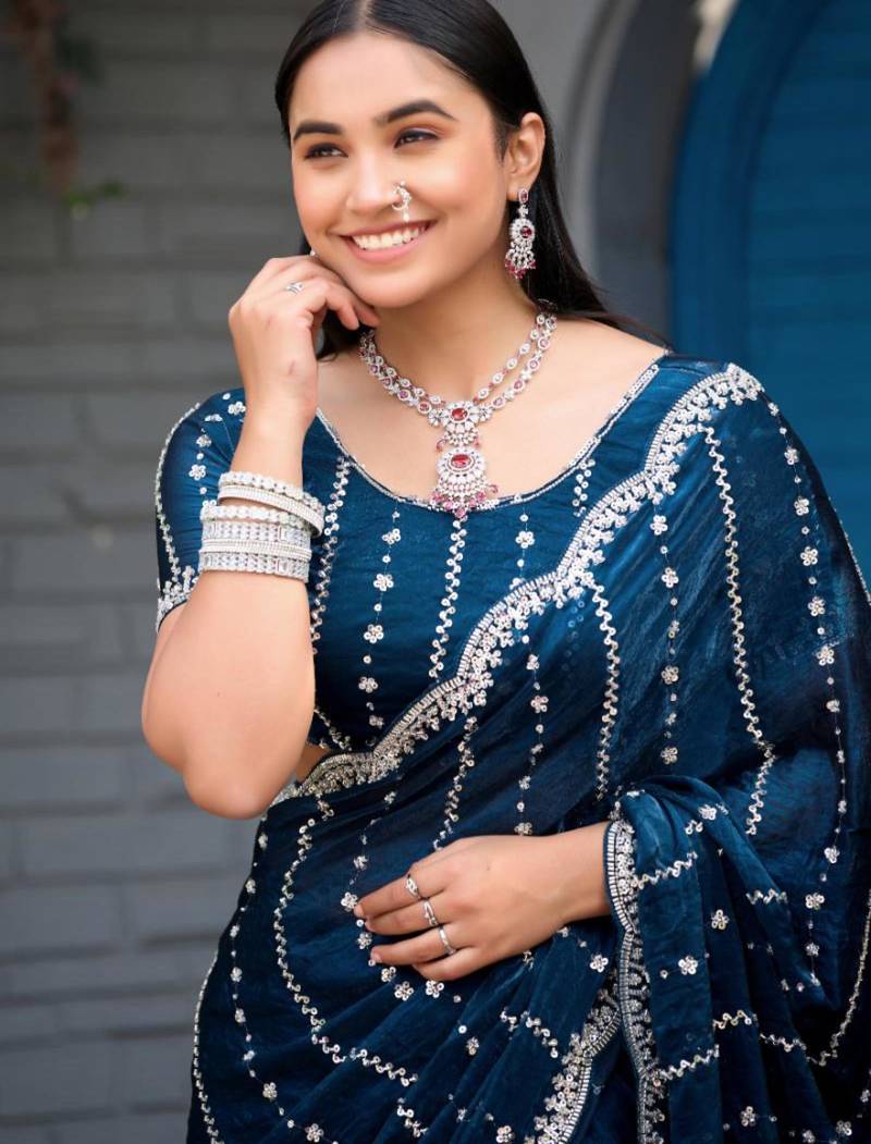 Ethnic midnight blue embellished pattern with border fandy satin saree with unstitched blouse