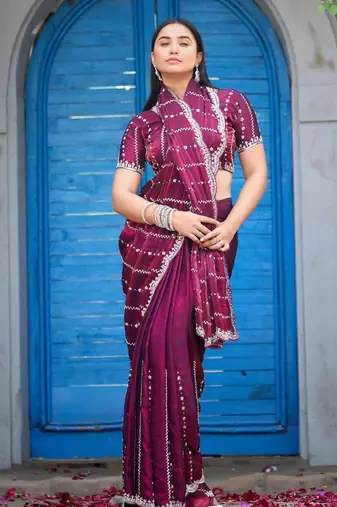 Traditional wine purple embellished pattern with border fandy satin saree with unstitched blouse