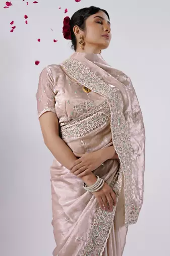 Fashionable peach designer border satin saree with unstitched blouse