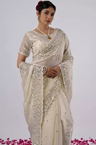 Elegance cream hevay sequin and stone border satin saree with unstitched blouse