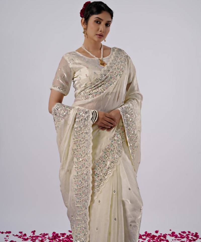 Elegance cream hevay sequin and stone border satin saree with unstitched blouse