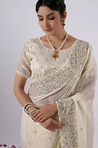 Elegance cream hevay sequin and stone border satin saree with unstitched blouse