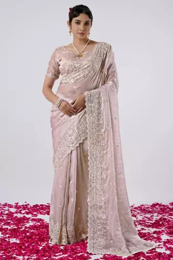 Celebrity inspired peach hevay sequin and stone border satin saree with unstitched blouse