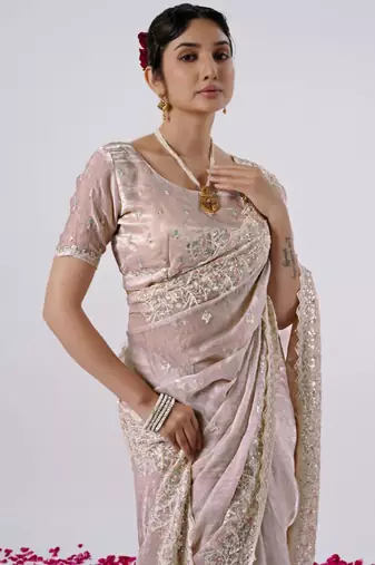 Celebrity inspired peach hevay sequin and stone border satin saree with unstitched blouse