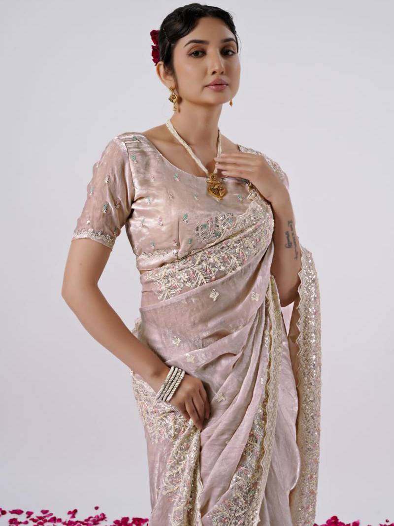 Celebrity inspired peach hevay sequin and stone border satin saree with unstitched blouse
