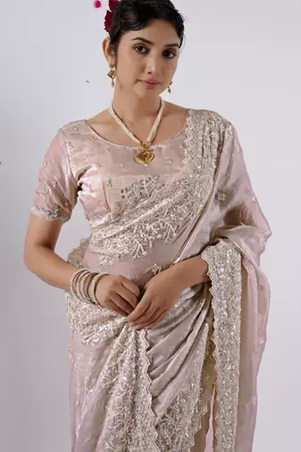 Celebrity inspired peach hevay sequin and stone border satin saree with unstitched blouse