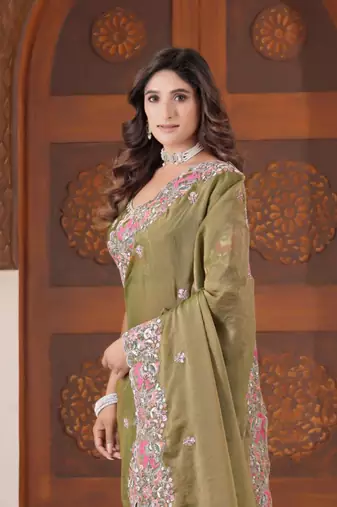 Celebrity inspired mustard olive embroidered elephant shimmer saree with unstitched blouse