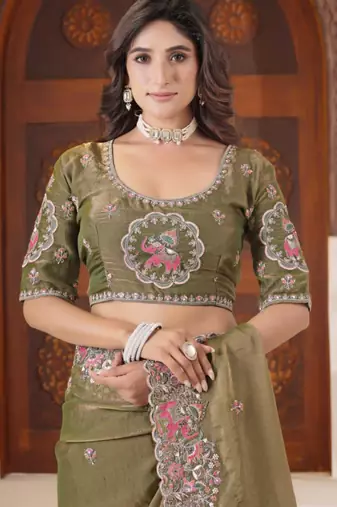 Celebrity inspired mustard olive embroidered elephant shimmer saree with unstitched blouse