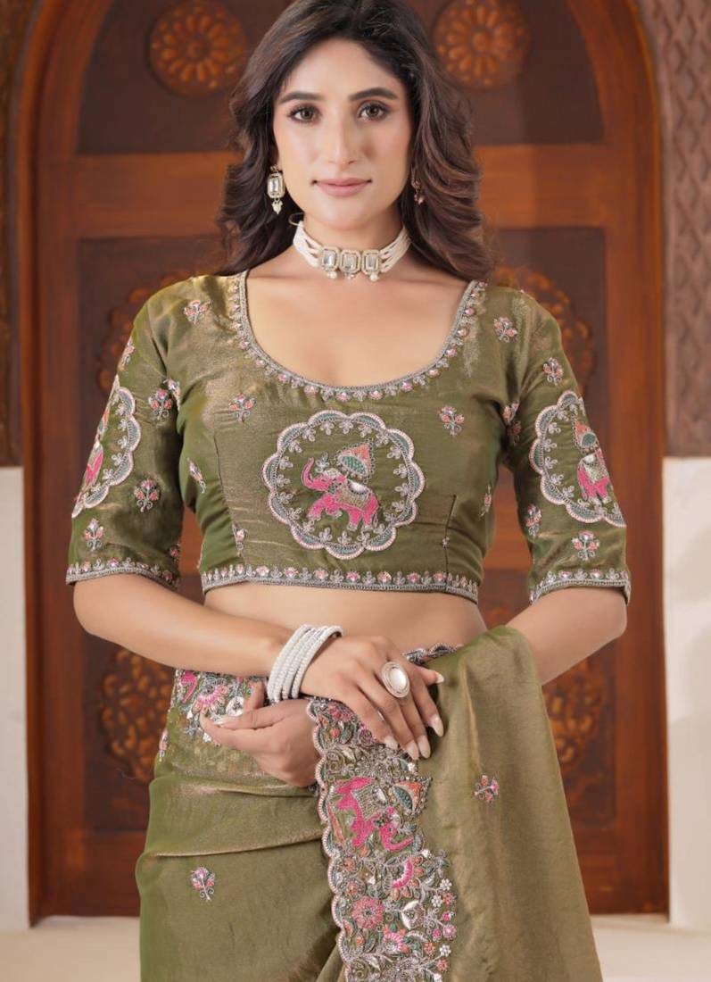 Celebrity inspired mustard olive embroidered elephant shimmer saree with unstitched blouse