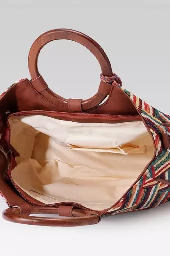  lines & loops tan jacquard chevron handheld bag