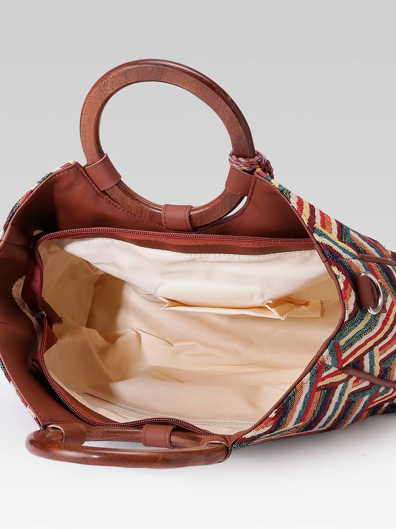  lines & loops tan jacquard chevron handheld bag