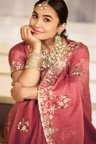 Embellished rose gold embroidered border motifs moss shimmer saree with unstitched blouse