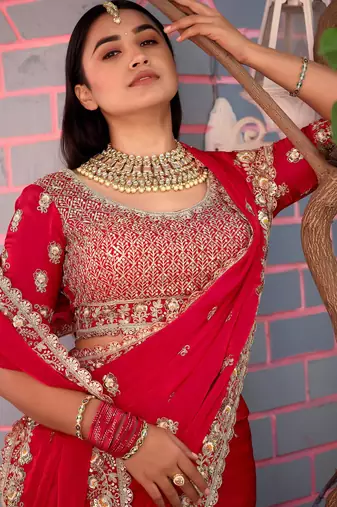 Fashionable red embroidered border motifs fandy satin saree with unstitched blouse