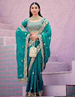 soft silk blend teal blue embroidered border motifs fandy satin saree with unstitched blouse 3