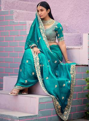 soft silk blend teal blue embroidered border motifs fandy satin saree with unstitched blouse 4
