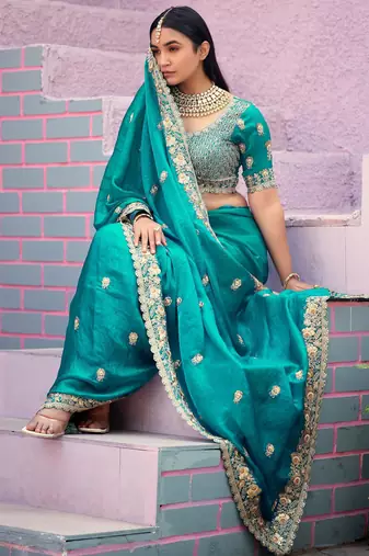 soft silk blend teal blue embroidered border motifs fandy satin saree with unstitched blouse