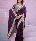 Celebrity type wine purple embroidered border motifs fandy satin saree with unstitched blouse