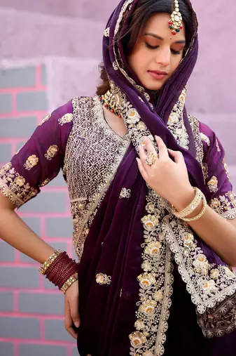 Celebrity type wine purple embroidered border motifs fandy satin saree with unstitched blouse