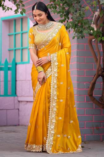 Floral yellow embroidered border motifs fandy satin saree with unstitched blouse