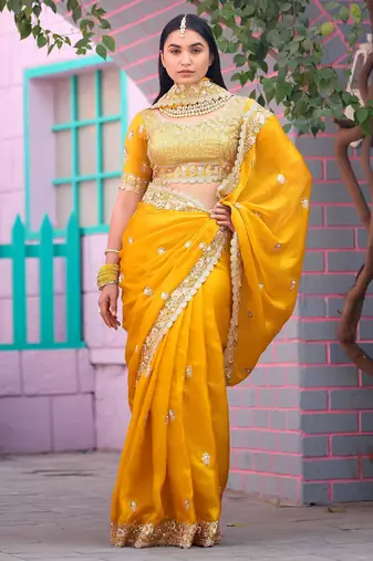Floral yellow embroidered border motifs fandy satin saree with unstitched blouse