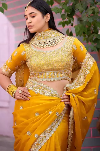 Floral yellow embroidered border motifs fandy satin saree with unstitched blouse