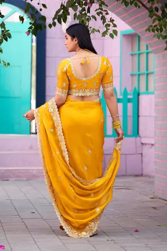 Floral yellow embroidered border motifs fandy satin saree with unstitched blouse