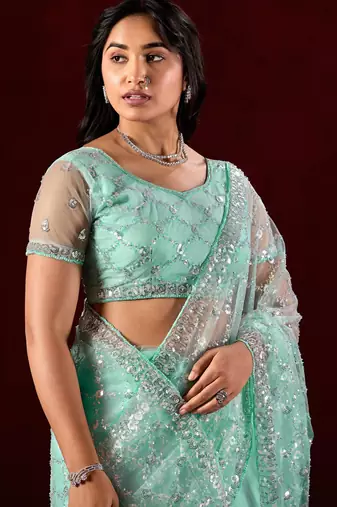 Embellished aqua sea green sequin embroidery embroidered border net saree with unstitched blouse