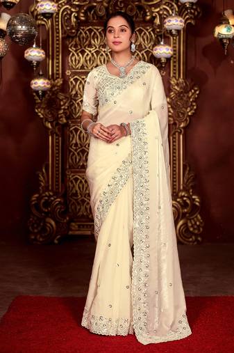 Celebrity inspired cream diamond sequin jaal embroidered border mono nylon fabric saree with unstitched blouse