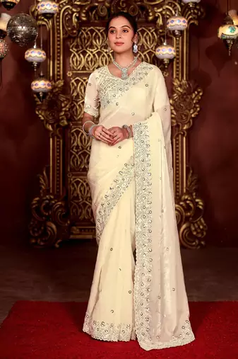Celebrity inspired cream diamond sequin jaal embroidered border mono nylon fabric saree with unstitched blouse