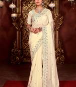 Celebrity inspired cream diamond sequin jaal embroidered border mono nylon fabric saree with unstitched blouse