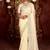 Celebrity inspired cream diamond sequin jaal embroidered border mono nylon fabric saree with unstitched blouse
