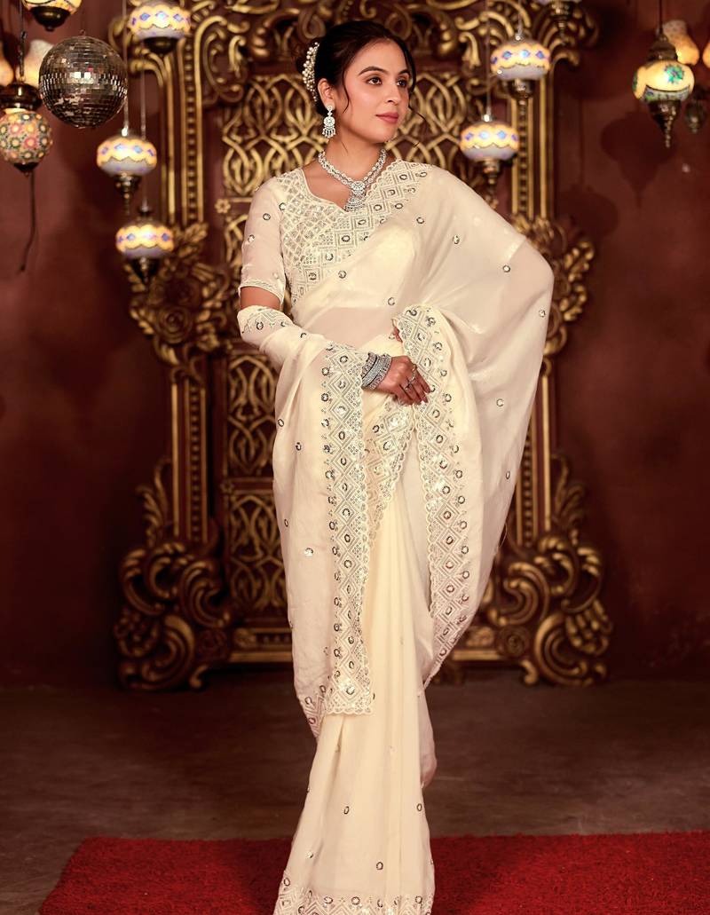 Celebrity inspired cream diamond sequin jaal embroidered border mono nylon fabric saree with unstitched blouse