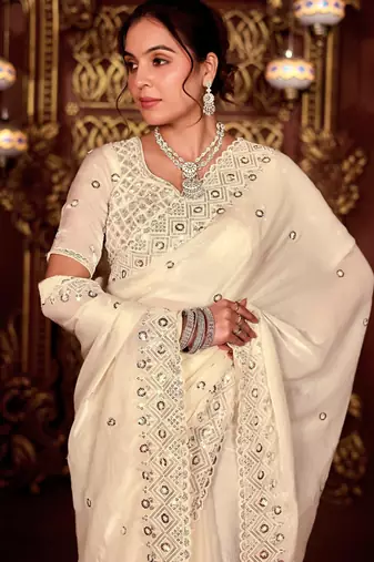 Celebrity inspired cream diamond sequin jaal embroidered border mono nylon fabric saree with unstitched blouse