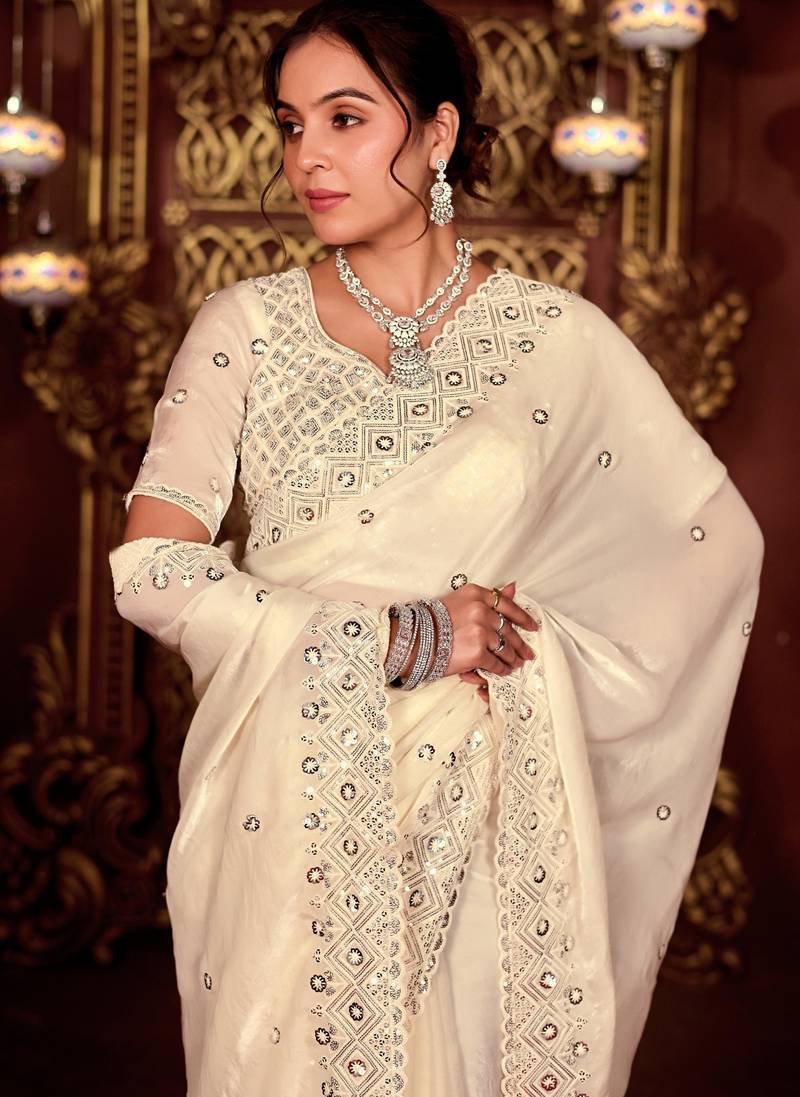 Celebrity inspired cream diamond sequin jaal embroidered border mono nylon fabric saree with unstitched blouse